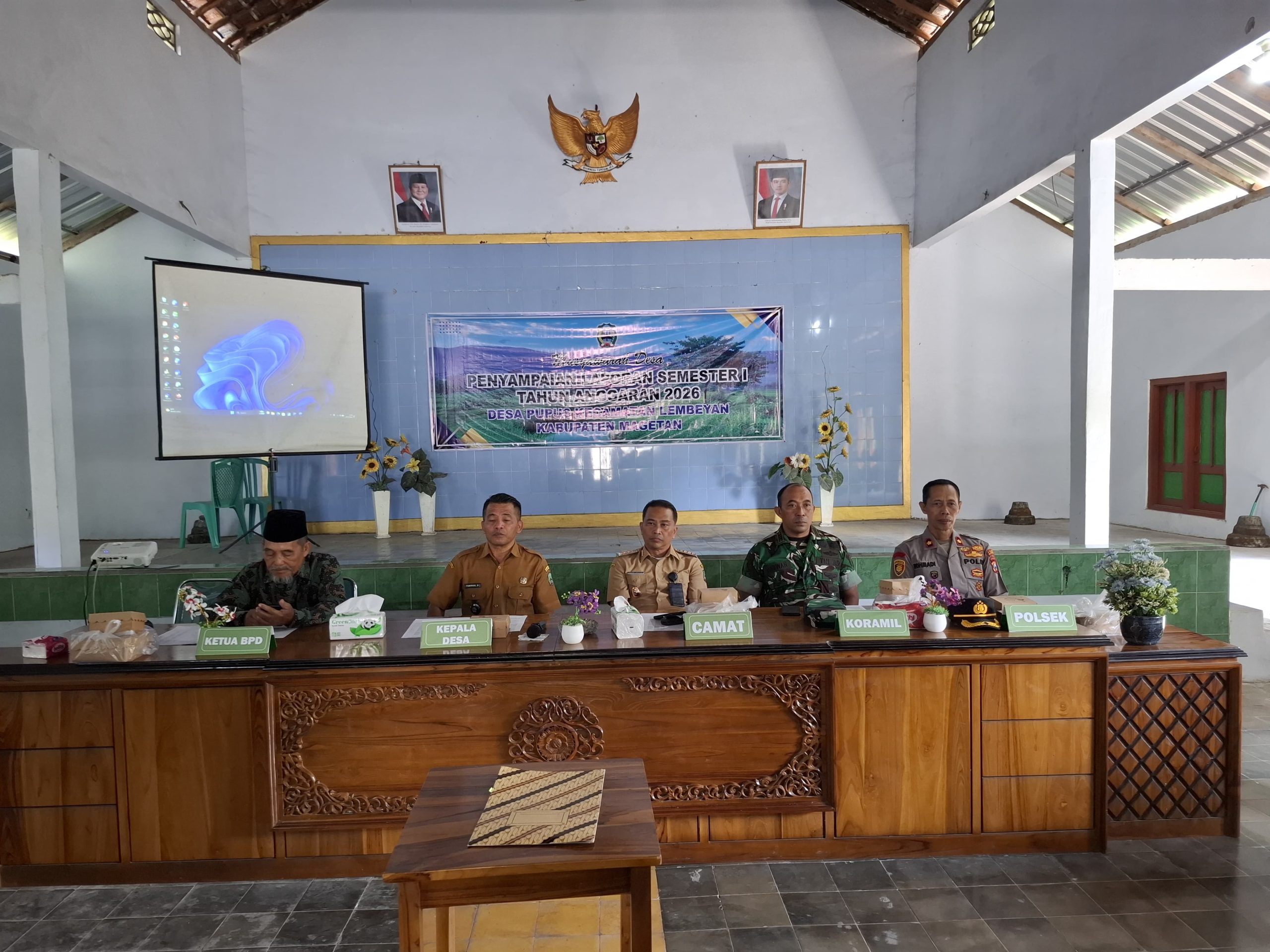 Kapolsek Lembeyan bersama Forkopimca Lembeyan hadiri kegiatan musdes penyampaian realisasi APBDes Semester 1 Tahun 2026 Desa Pupus Kecamatan Lembeyan
